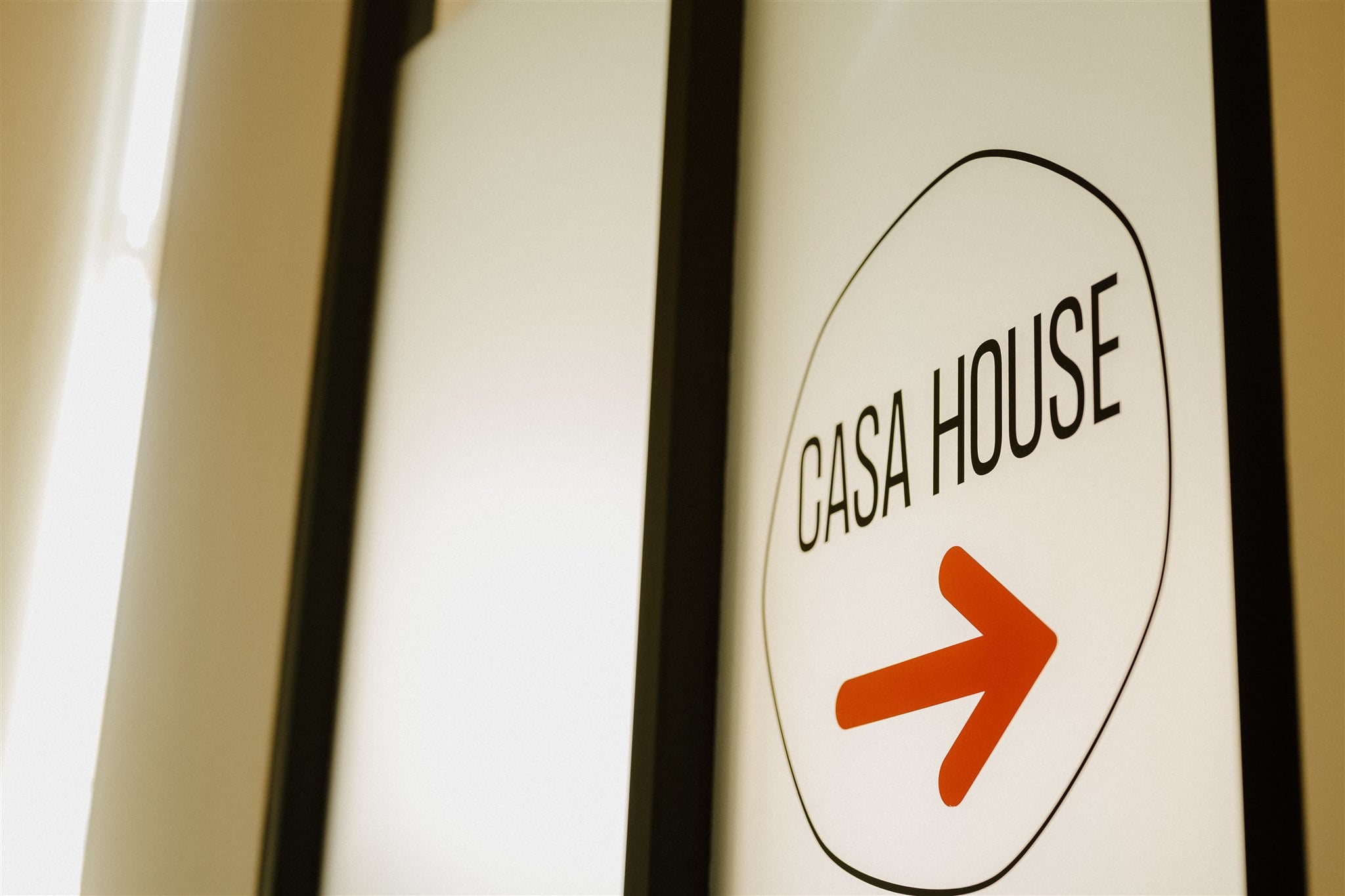 The CASA House sign on a wall.